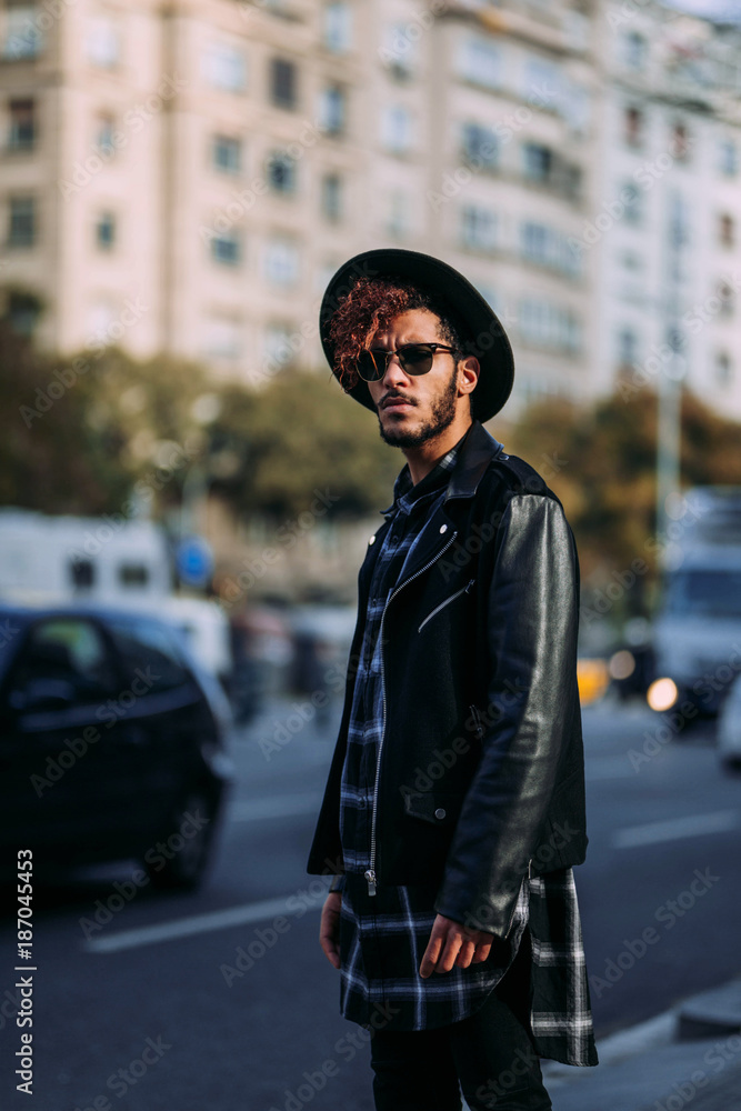 Man wearing black leather jacket and hat Man wearing black leather jacket and hat