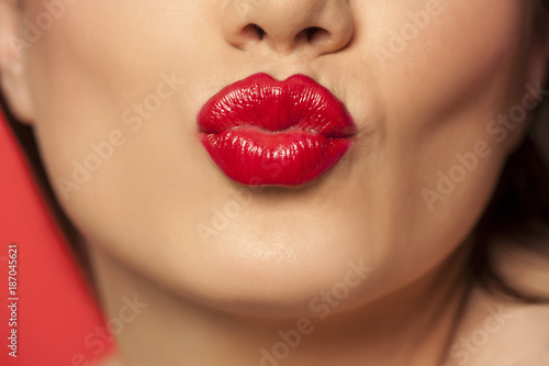 woman's lips with red lipstick photo
