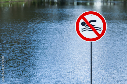 lake with prohibited sign swimming