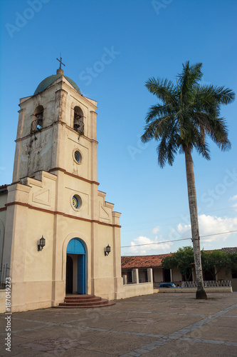 Church of vinales and palm at sunset