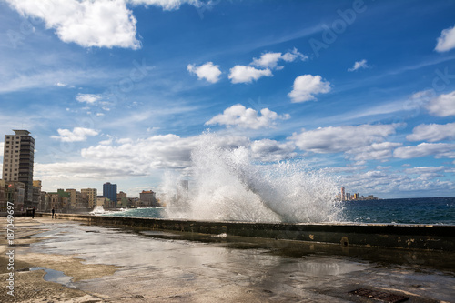 Promenade of the Malecon of Havana with crashing waves
