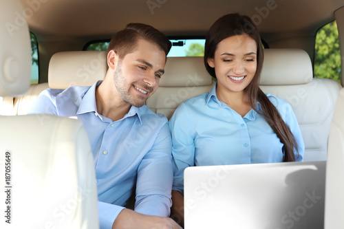 Beautiful young couple sitt...