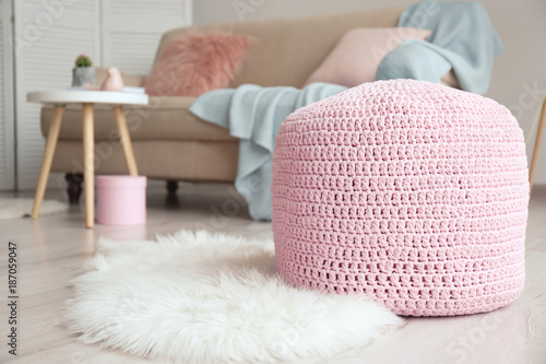 Knitted pouf in living room photo