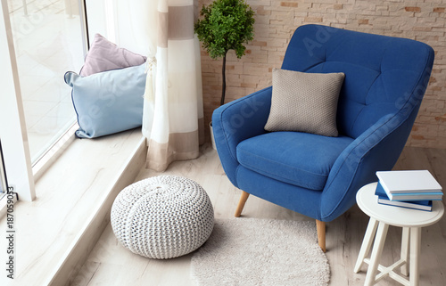 Foto Interior of living room with comfortable armchair