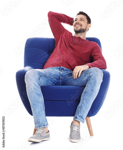 Handsome young man sitting ...