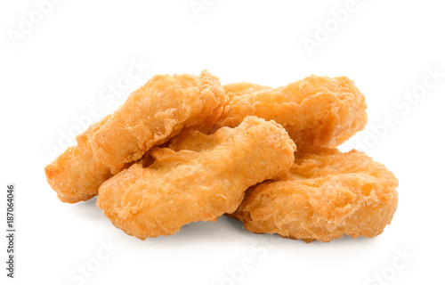 Tasty chicken nuggets on white background