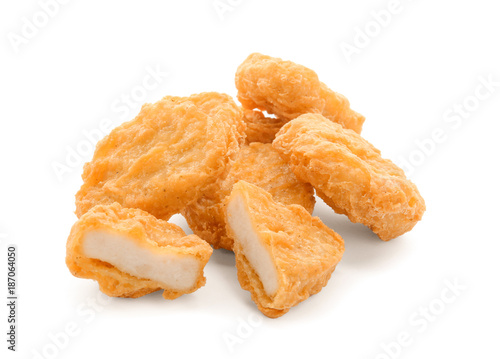 Tasty chicken nuggets on white background