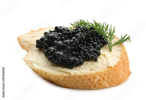 Bread with black caviar and butter on white background
