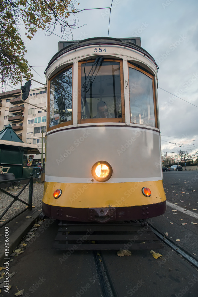 Historical yellow tram on Lisbon city, Portugal.