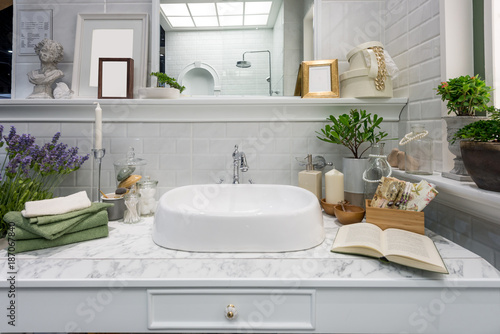 Interior of bathroom with sink basin faucet and mirror. Modern design of bathroom.