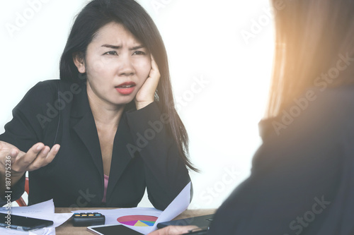 Asian woman boss angry and complaining her teamwork during working together in a meeting room
