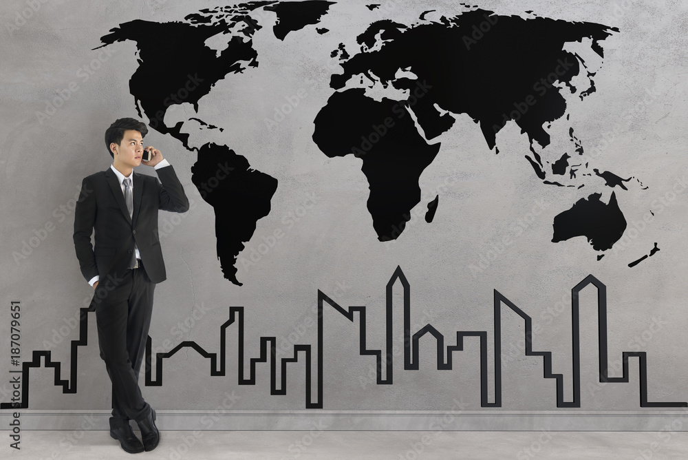 businessman wearing a black suit using smartphone standing against the wall have black world map and city. 3D Rendering.