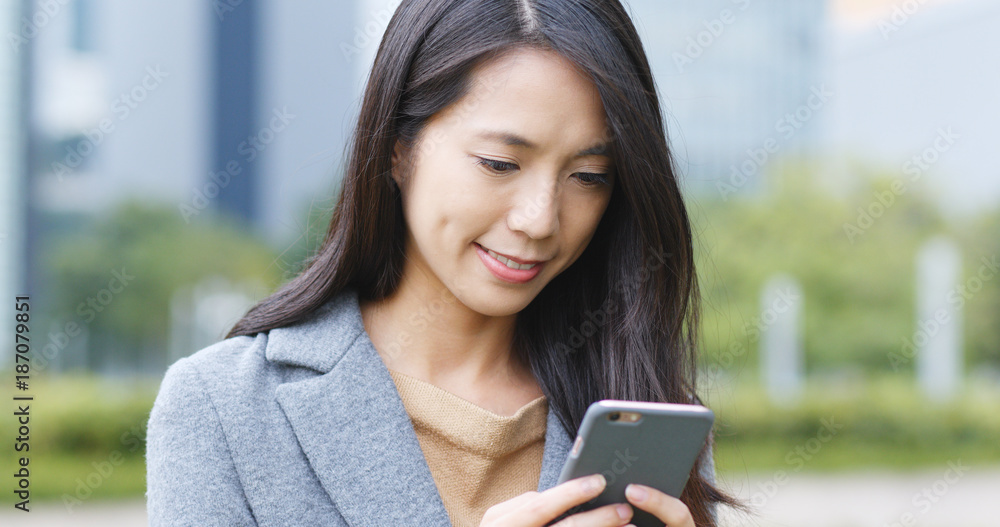 Asian woman use of mobile phone at outdoor Asian woman use of mobile phone at outdoor