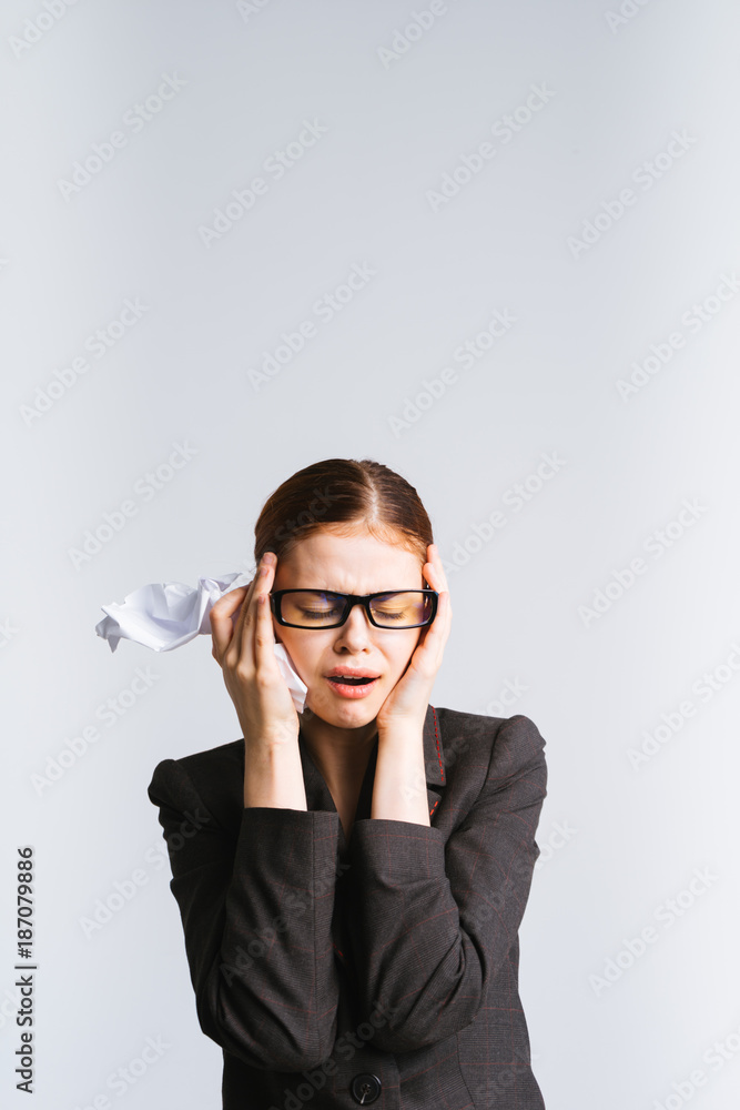 girl secretary with a handkerchief in her hand sadly holding herself by the head girl secretary with a handkerchief in her hand sadly holding herself by the head