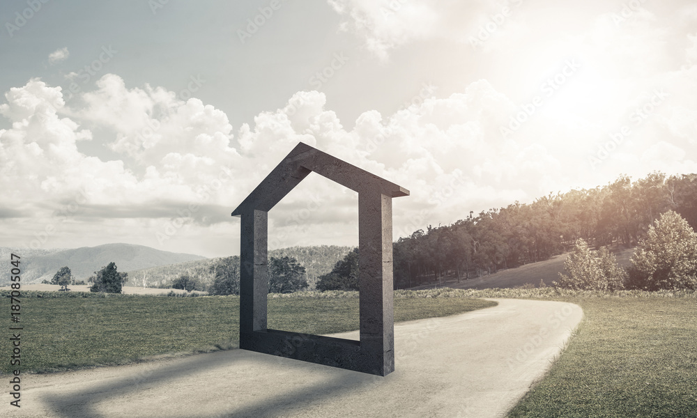 Conceptual background image of concrete home sign on country roa
