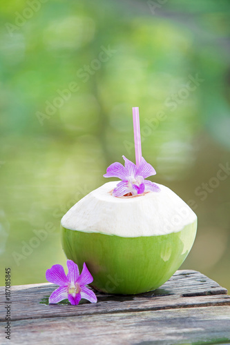 Fresh green coconuts with drinking straw
