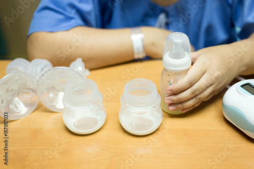 New mother with automatic breast pump. Mother breasts milk is the most healthy food for newborn baby
