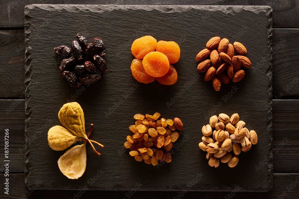 Dried fruits and nuts on slate plate Dried fruits and nuts on slate plate