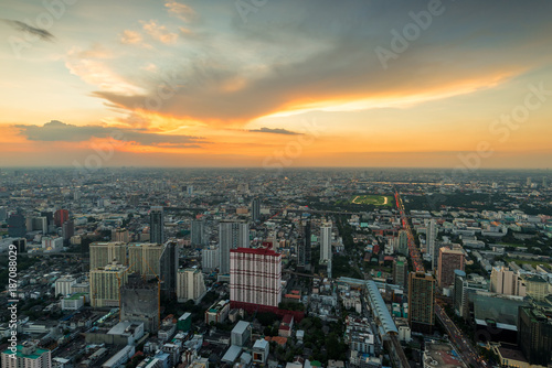orange sunset sky over a large metropolis in Asia, Bangkok, Thailand
