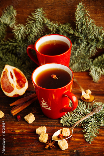 Christmas hot cranberry tea, cookies and light bokeh, closeup © malykalexa777
