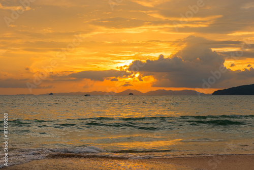 bright orange sunset with beautiful clouds over the sea of Thailand, Krabi province