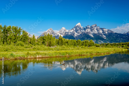 Mountains in Grand Teton National Park with reflection in Snake River