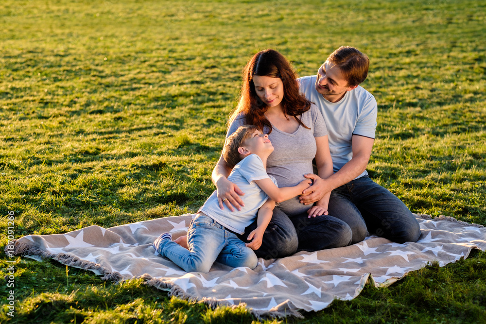 Happy pregnant family of three expecting new baby Happy pregnant family of three expecting new baby