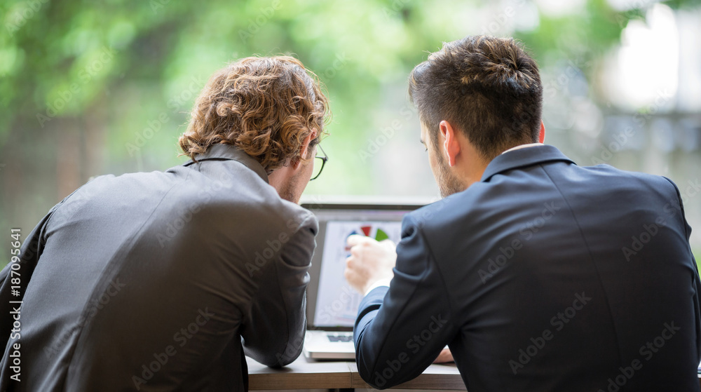 Confident Business People using tablet in Coffee Shop. Confident Business People using tablet in Coffee Shop.