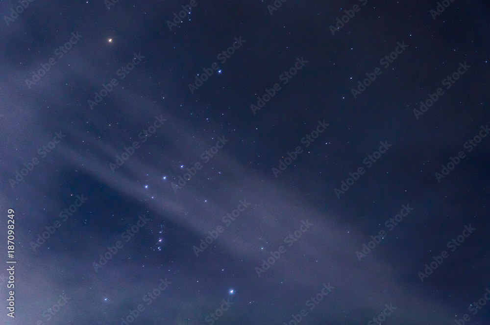 Obraz premium The constellation of Orion in the night sky by the light of the moon.