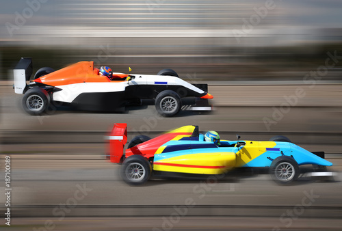 Formula 4.0 race cars racing at high speed