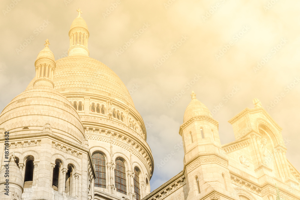 dome of a catholic church. Montmartre near Basilica Sacre Coeur designed by Paul Abadie, 1914 - Roman Catholic Church and minor basilica, dedicated to Sacred Heart of Jesus.