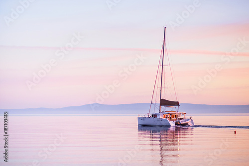 Sailing yacht in Mediterranean sea at sunset. Travel and active lifestyle concept © kite_rin