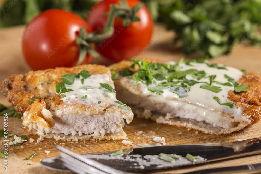 Pork schnitzel with white sauce and parsley Pork schnitzel with white sauce and parsley