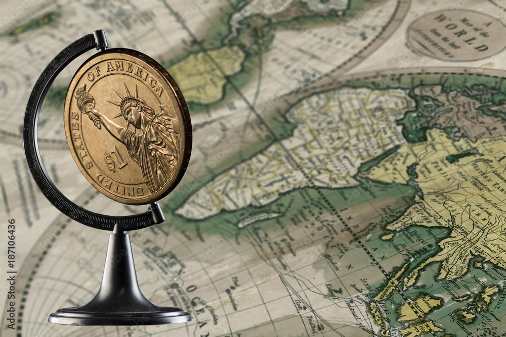Obraz premium Coin one dollar and world map