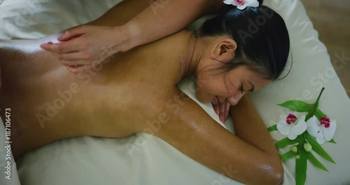 Woman relaxing enjoying massage at the spa photo