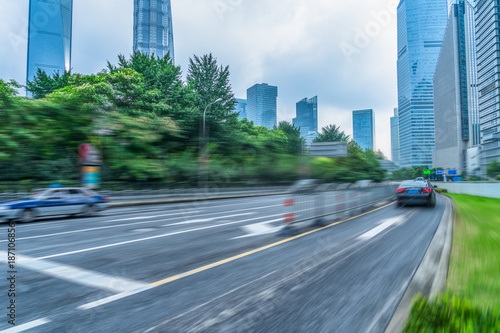 blurred asphalt road through modern city in Shanghai, China