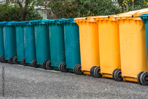 trash cans standing in a row © hallojulie
