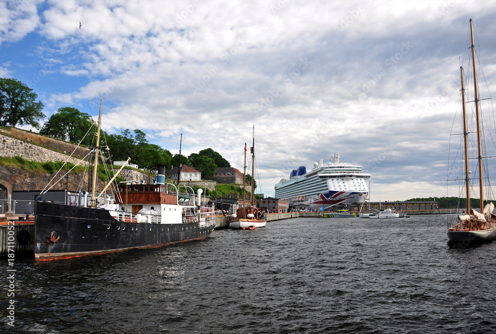 Boats moored in the afternoon in Oslo Harbor.