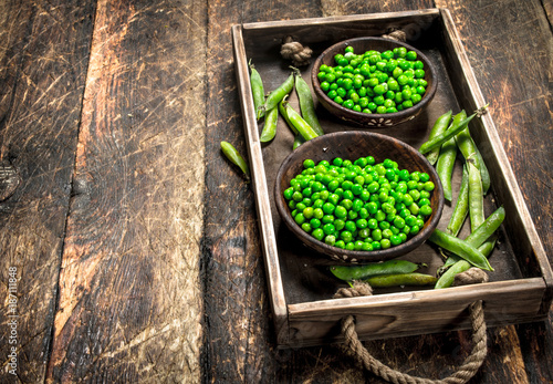 Fresh green peas in a bowl.
