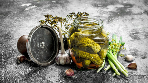 Pickled cucumbers with seamer. photo