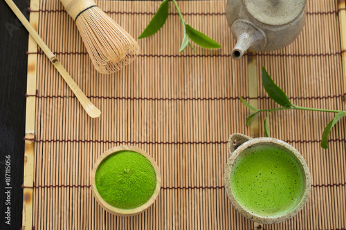 Fototapeta Naklejka Na Ścianę i Meble -  Set of matcha powder bowl wooden spoon and whisk green tea leaf Organic Green Matcha Tea ceremony