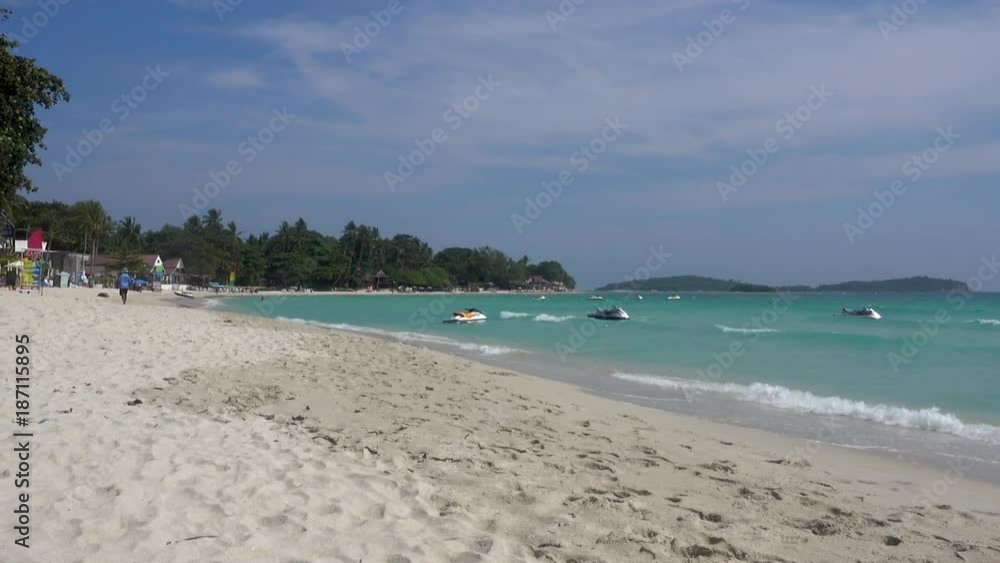 Rolling Waves at Chaweng Beach on Koh Samui Island in Thailand. Jet ski, water motorcycle or bike on wavy sea