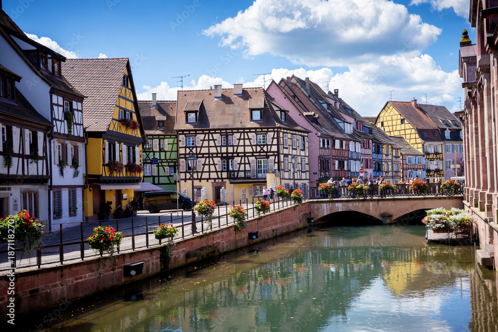COLMAR, ALSACE – FRANCE. Colorful traditional french houses on the side of river Lauch in Petite Venise, Colmar, France