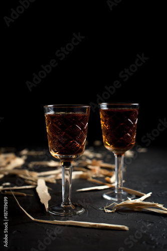 Canvas Print two glasses with wine on a dark background