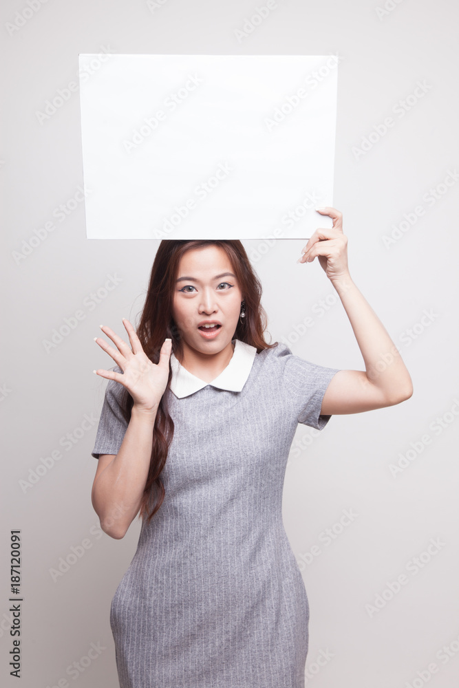 Young Asian woman surprise with white blank sign. Young Asian woman surprise with white blank sign.