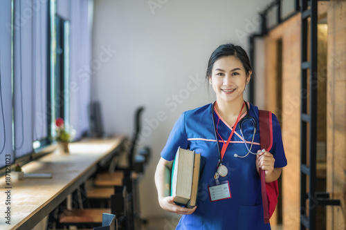 Fotografie, Obraz Young asian woman is going to nursing school