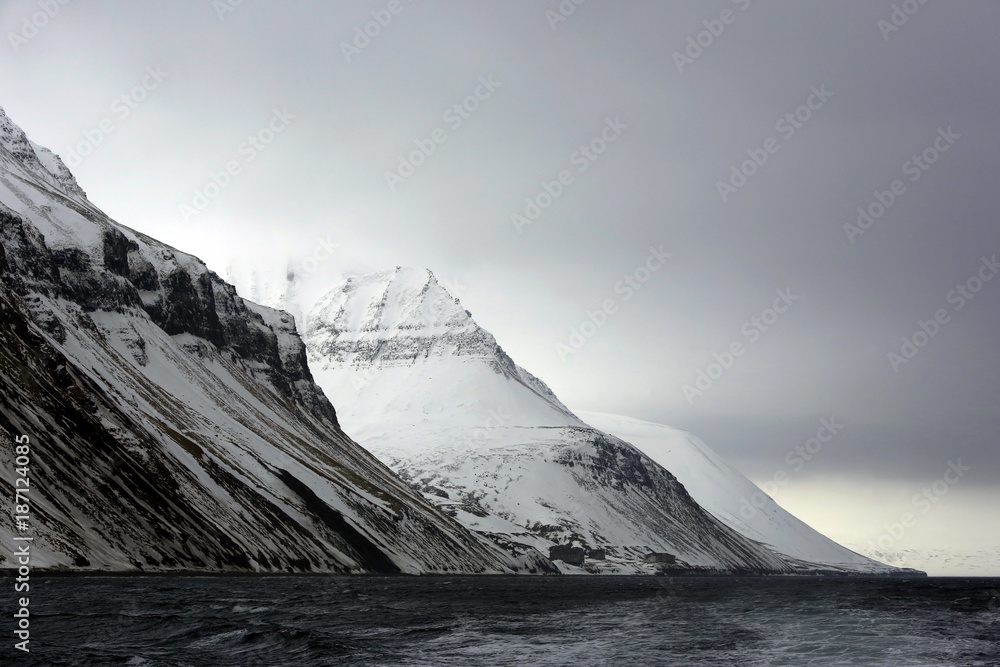 Naklejka premium Mountains outside Longearbyen, Viewed from Water. Svalbard, Norway