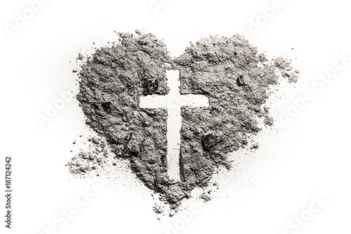 Cross or crucifix in heart symbol made of ash