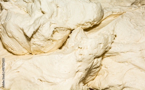 Pizza dough. Close - up. Food, italian cuisine and cooking concept. Preparation of the Italian Pizza photo