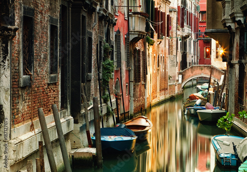 Picturesque canal in the beautiful city of Venice, Italy.